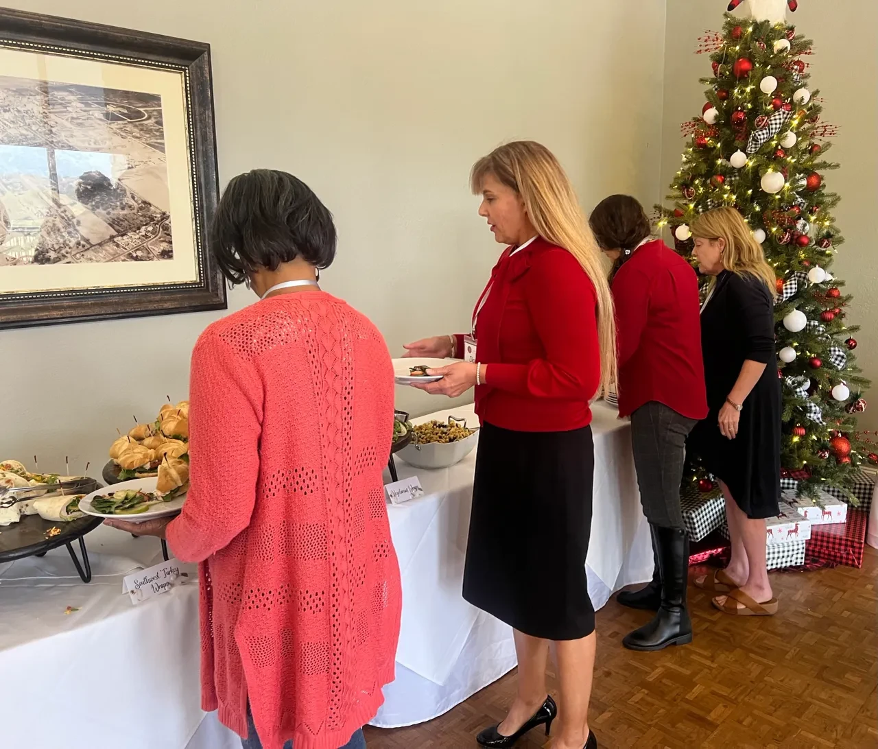 Women at holiday buffet table