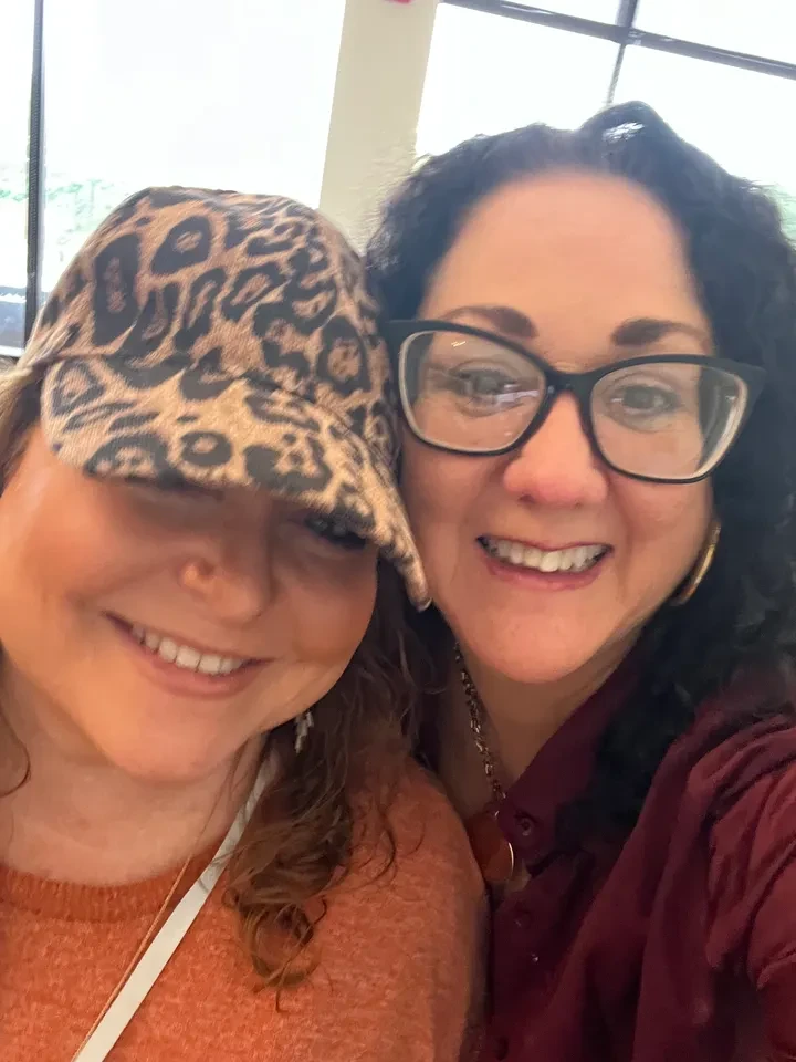 Two women smiling at event
